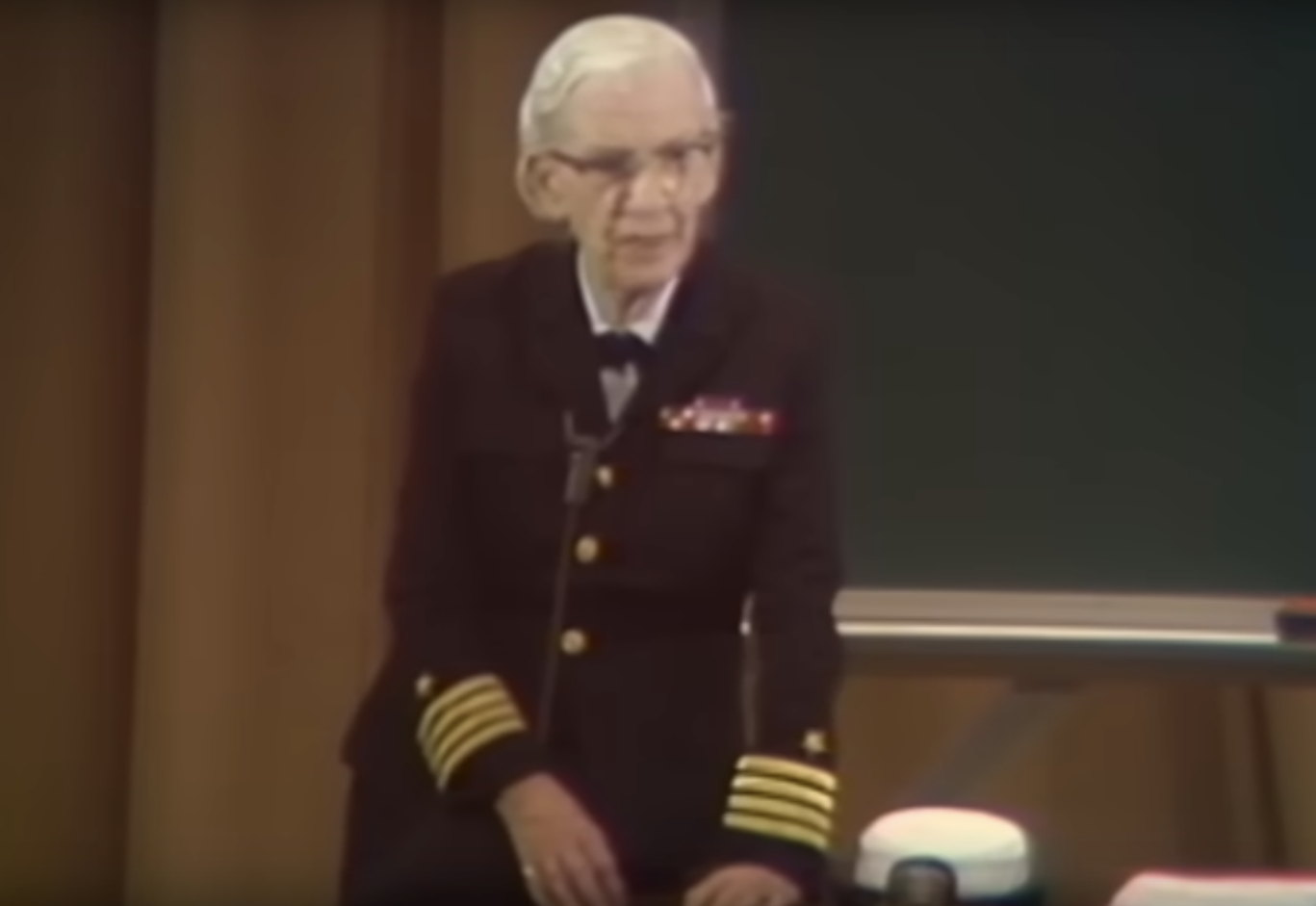 The official portrait of Grace Hopper with a heavily medaled uniform.