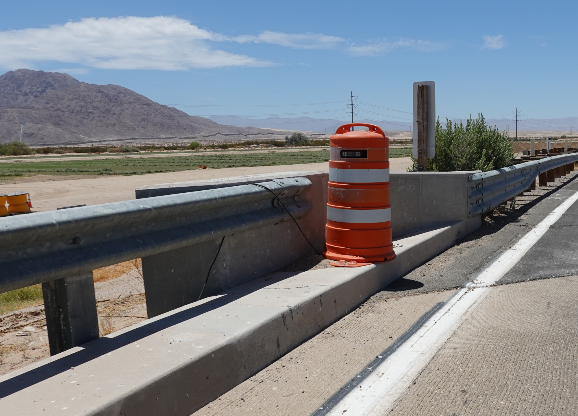 A camera hidden inside an orange traffic barrell